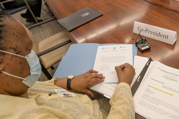 Minister Pandor signs the Final Declaration.